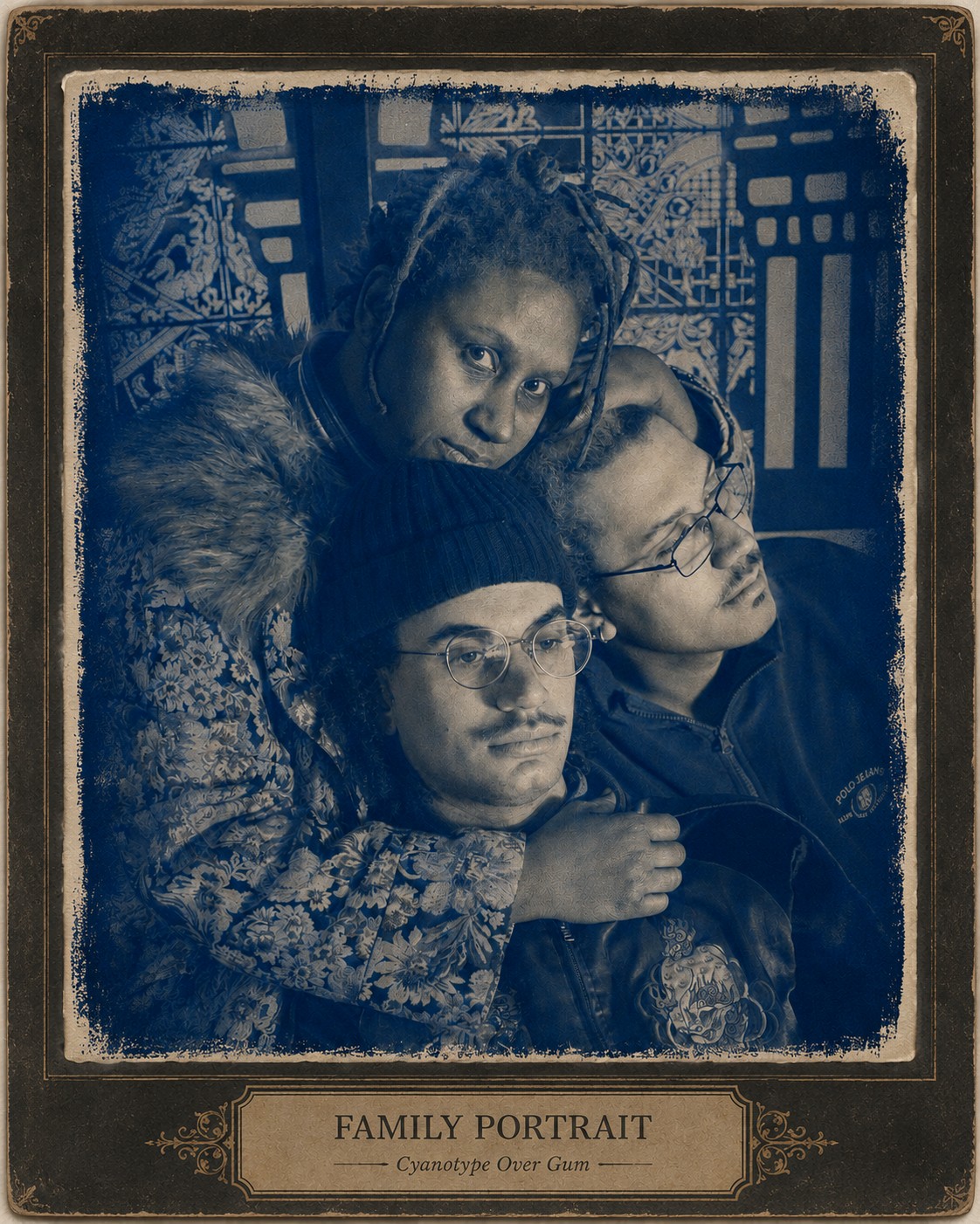 Mother and two sons snuggling  inside FableType installation printed as cyanotype.